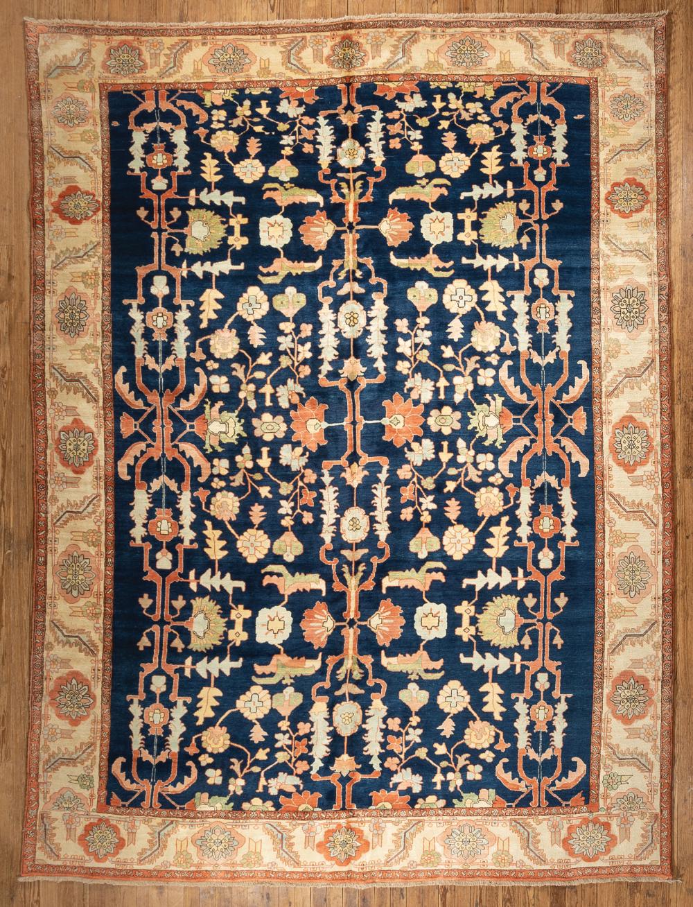 Appraisal: Persian Serapi Carpet blue ground cream and salmon border overall