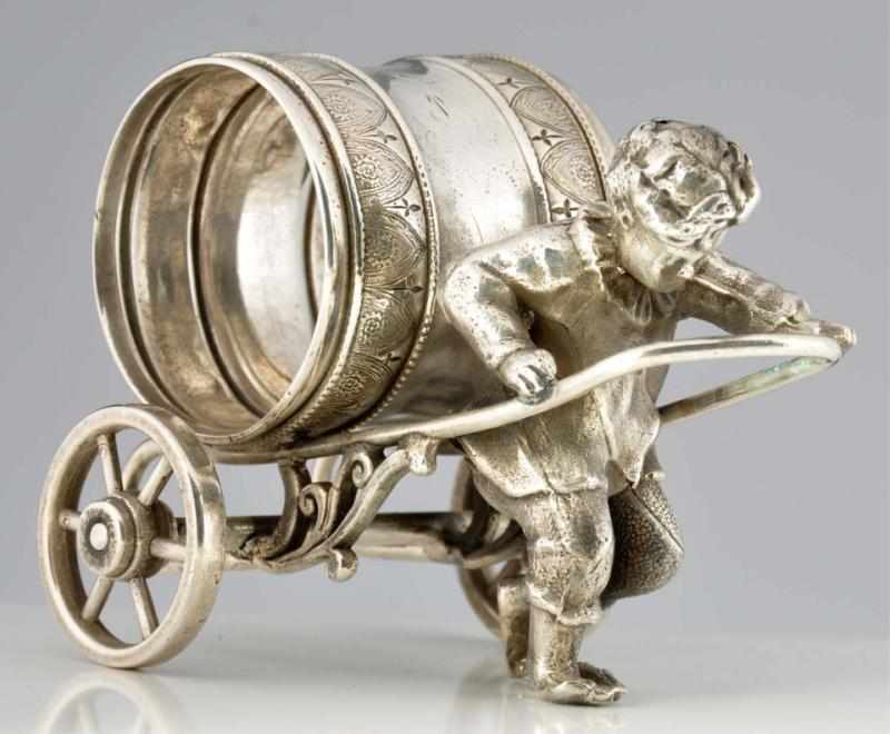 Appraisal: Boy Pulls Napkin Holder Figural Napkin Ring On wheels Condition