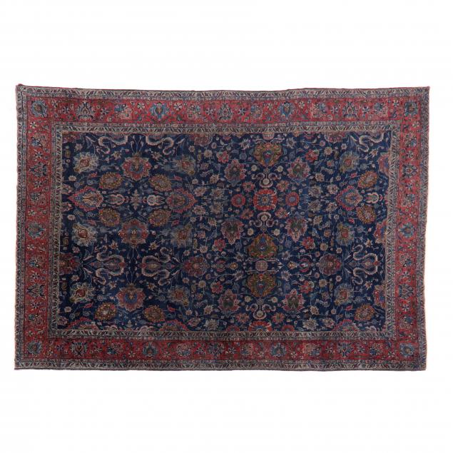 Appraisal: NORTHWEST PERSIAN RUG Navy blue field with allover floral design