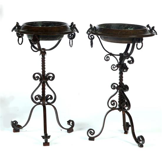 Appraisal: PAIR OF STANDING FLOOR BASINS European th century wrought iron