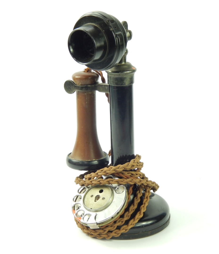 Appraisal: A black and brown metal and Bakelite candlestick telephone