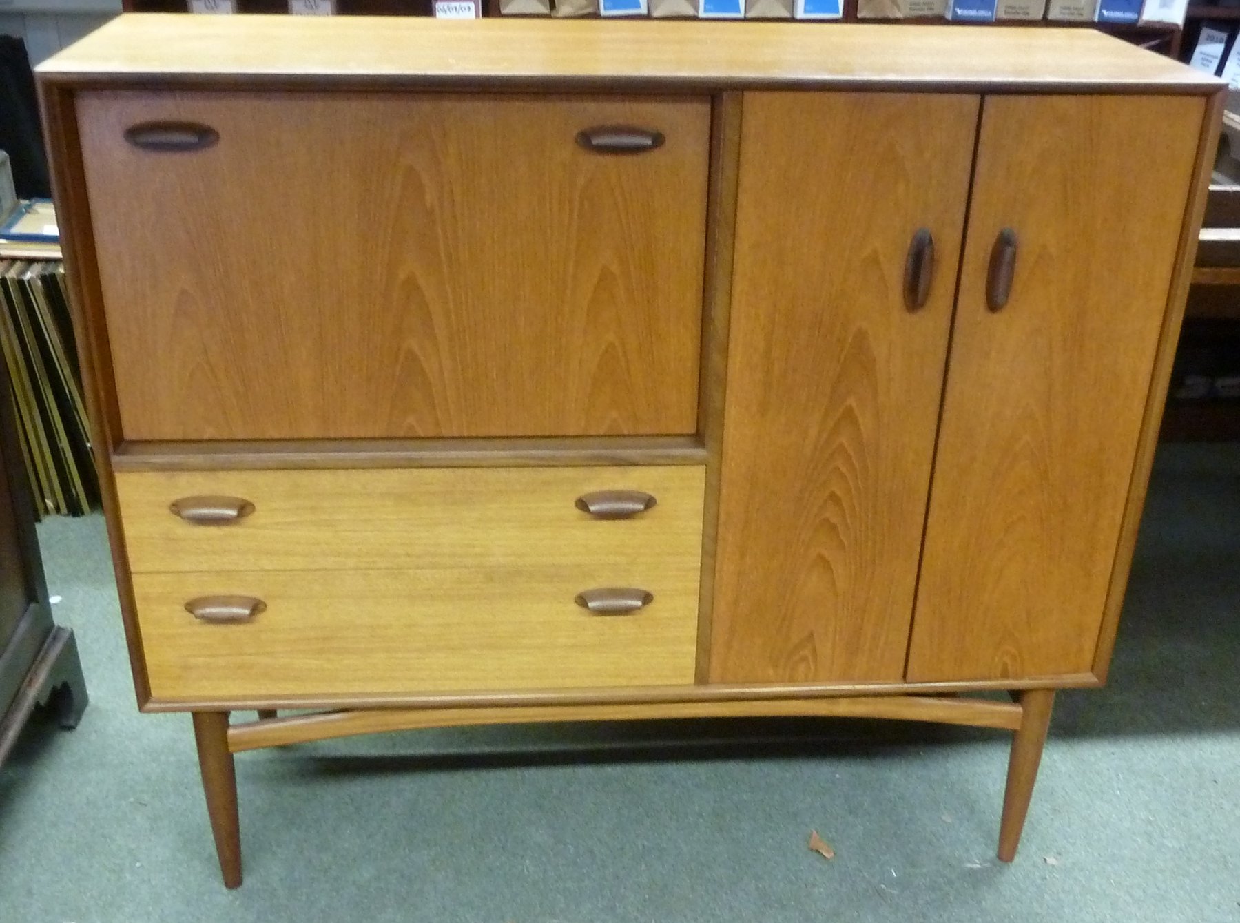 Appraisal: A G-plan teak cocktail cabinet with drawers and cupboard on