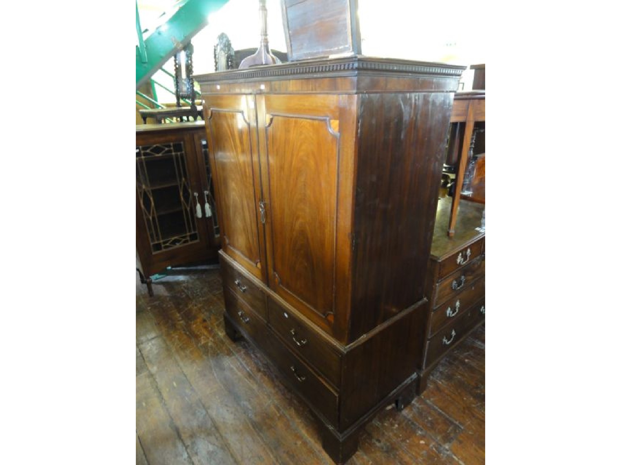 Appraisal: A th century mahogany press the lower section enclosed by