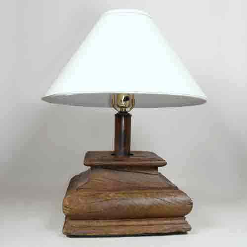 Appraisal: An Indian Teak Capital Table Lamp th century having a