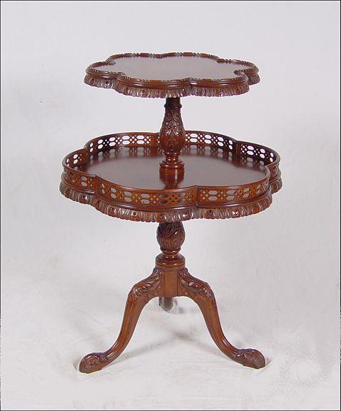 Appraisal: TWO TIER MAHOGANY BUTLER'S TABLE Floral shaped tiers with drape