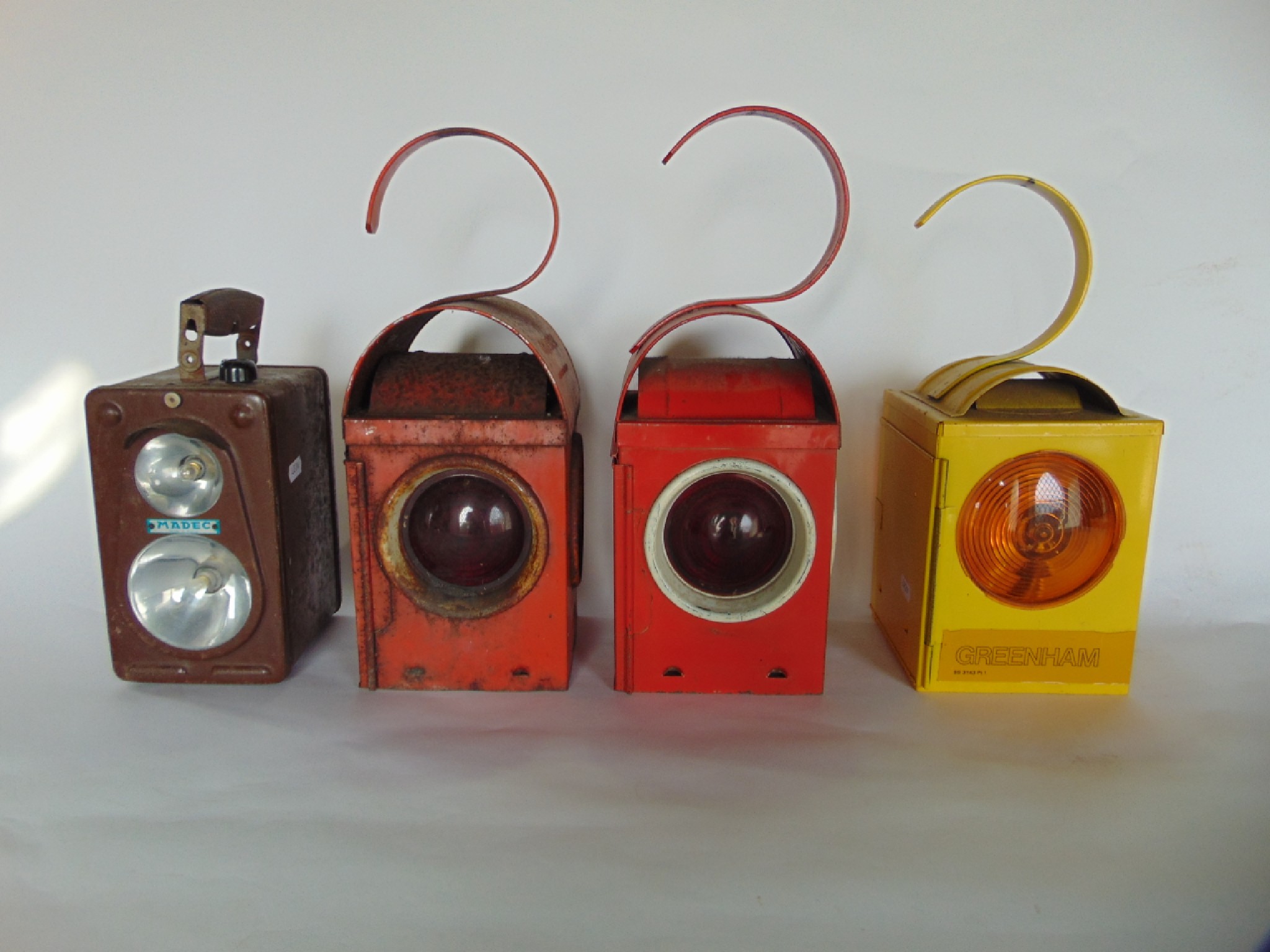 Appraisal: Two similar th century metallic lanterns with red colourway one