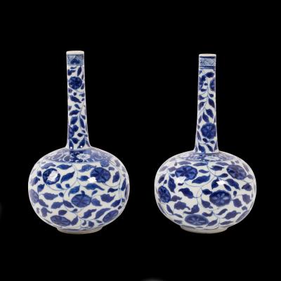 Appraisal: A pair of Chinese blue and white floral bottle vases