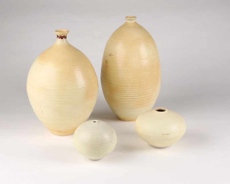 Appraisal: A group of four Otto Heino cream-glazed stoneware vases Marked