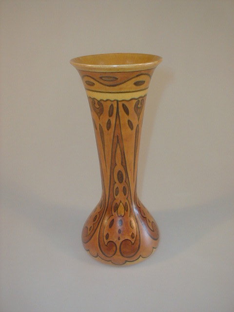 Appraisal: A Chameleon ware pottery vase of elongated baluster form painted