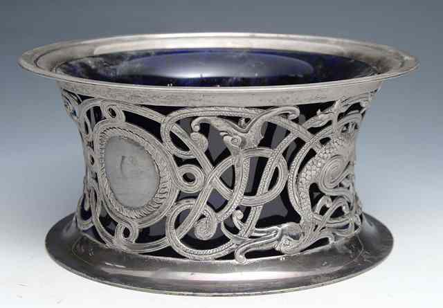 Appraisal: AN IRISH SILVER DISH RING with pierced sides decorated with