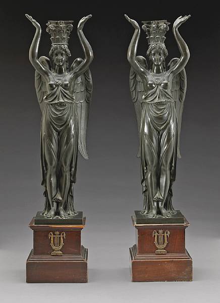 Appraisal: A pair of Empire style patinated bronze standards Each in