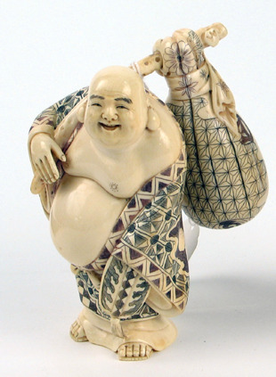 Appraisal: JAPANESE CARVED IVORY FIGURE OF HOTEI The benevolent smiling figure