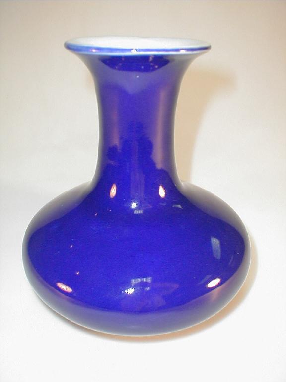 Appraisal: A Japanese pottery vase of compressed baluster form externally with