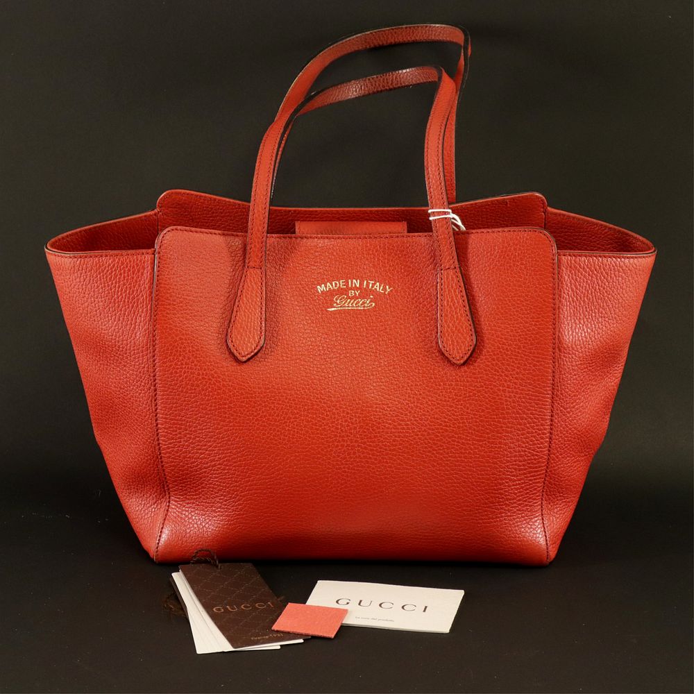 Appraisal: Gucci - Swing Tote Gucci red grained leather swing tote