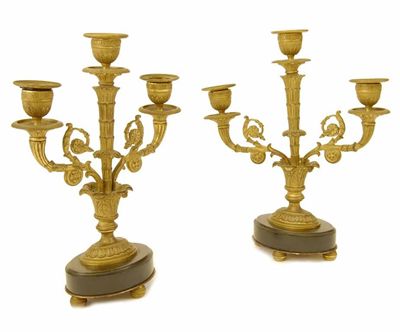 Appraisal: A pair of th century ormolu three light candelabra on