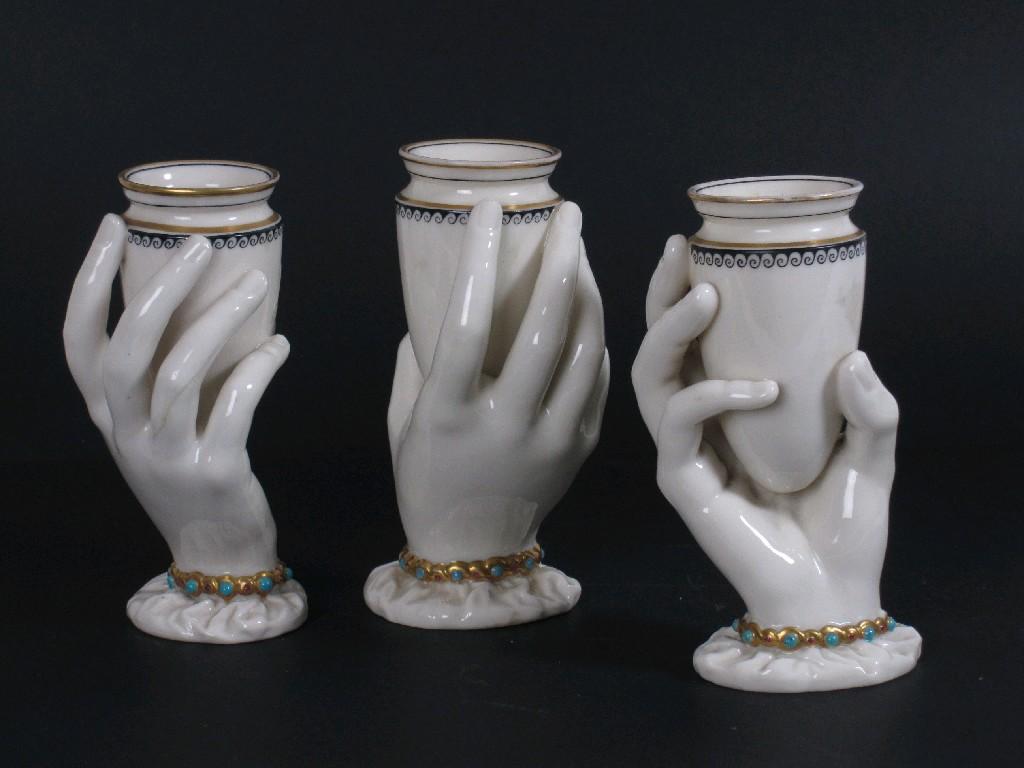 Appraisal: Three Worcester Posy Vases in the form of hands supporting