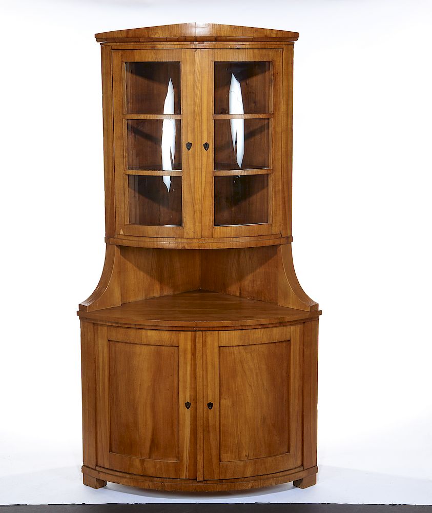 Appraisal: Biedermeier fruitwood corner cabinet Biedermeier fruitwood corner cabinet th century