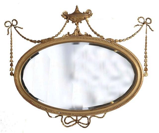 Appraisal: A GILT ADAMS STYLE WALL MIRROR with ribbon foliate and