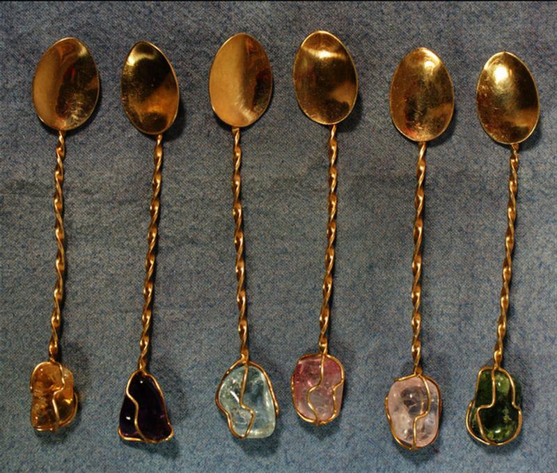 Appraisal: K YG demitasse spoons each mounted with a colored gemstone