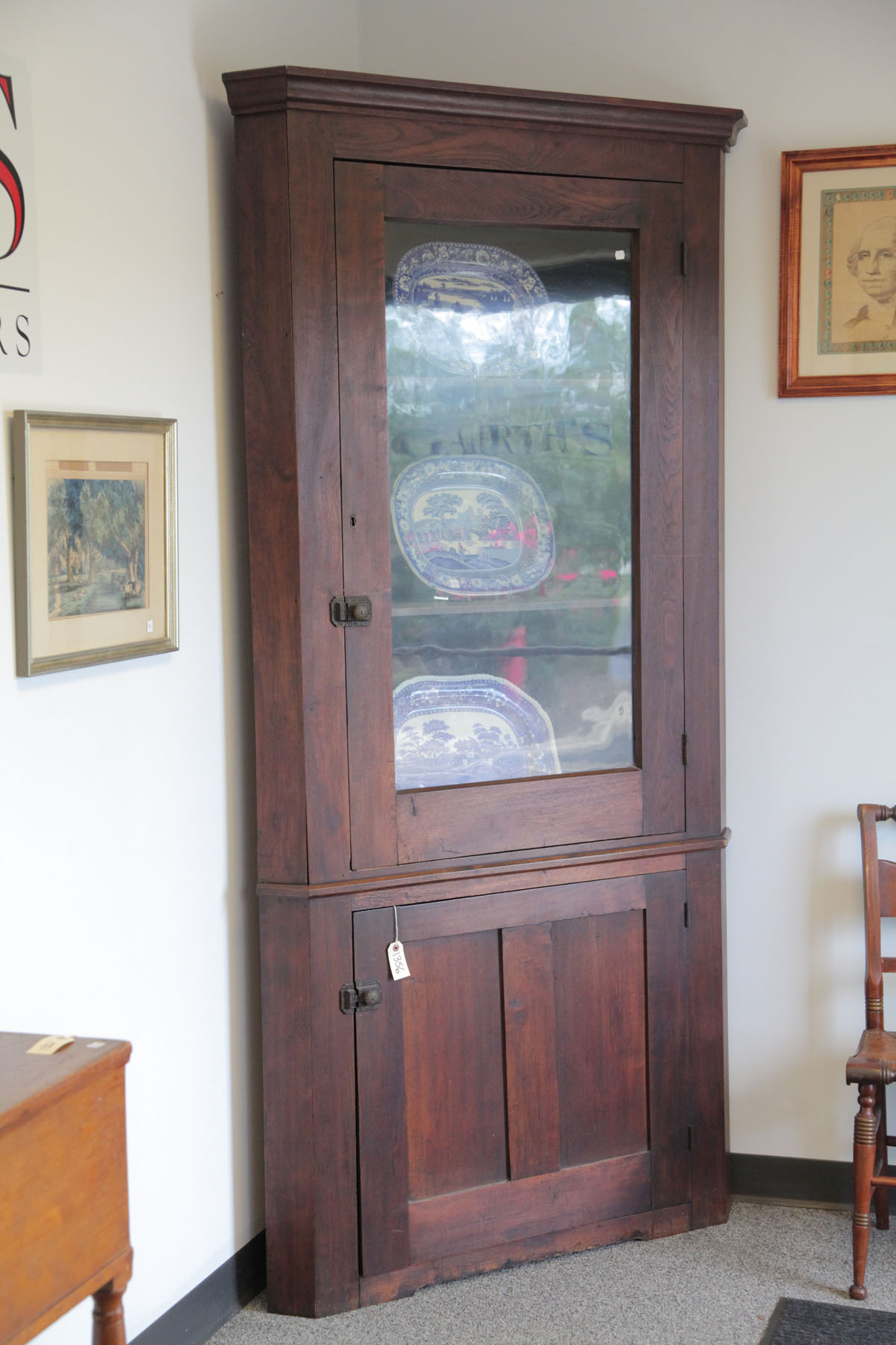 Appraisal: CORNER CUPBOARD American late th century Two piece walnut cupboard