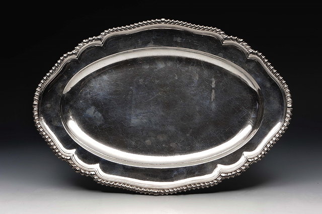 Appraisal: A GEORGE II SILVER MEAT DISH oval with shaped edge