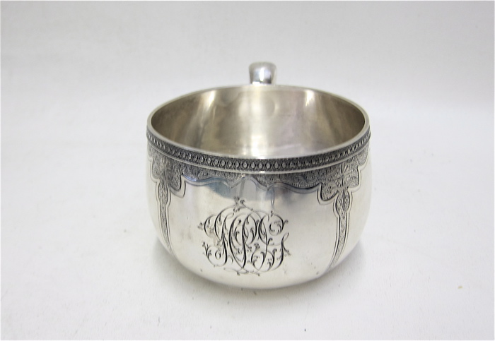 Appraisal: TIFFANY CO STERLING SILVER HANDLED CUP pattern chased and engraved