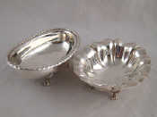 Appraisal: An oval dish on four feet with gadrooned rim and