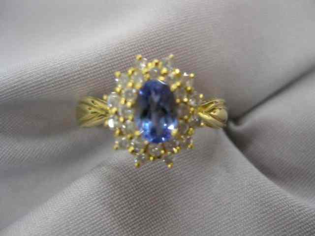 Appraisal: Tanzanite Diamond Ring fine oval blue carat gem surrounded by