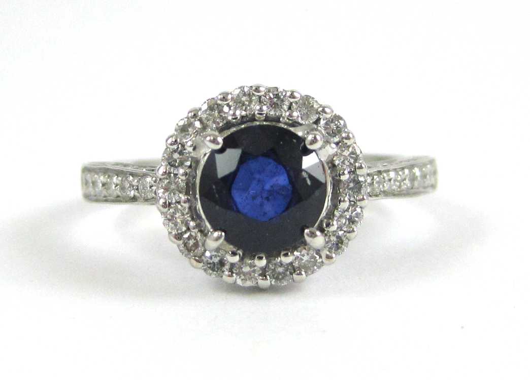 Appraisal: SAPPHIRE DIAMOND AND FOURTEEN KARAT GOLD RING The white gold