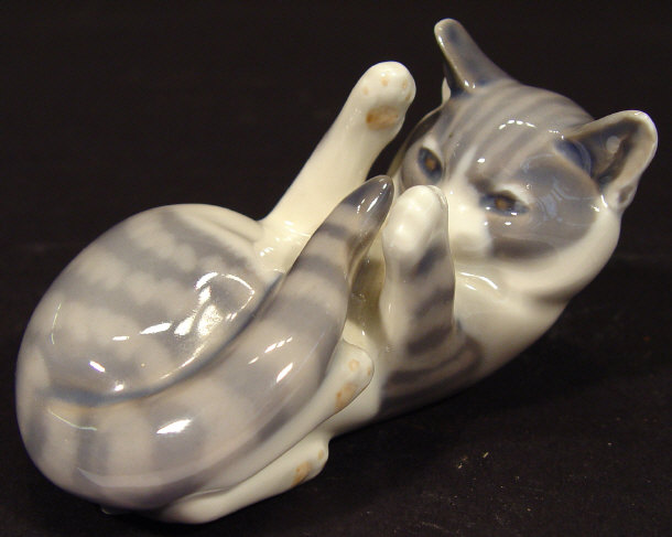 Appraisal: Royal Copenhagen reclining china tabby cat with hand painted decoration