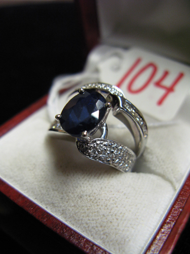 Appraisal: SAPPHIRE DIAMOND AND FOURTEEN KARAT WHITE GOLD WEDDING SET the