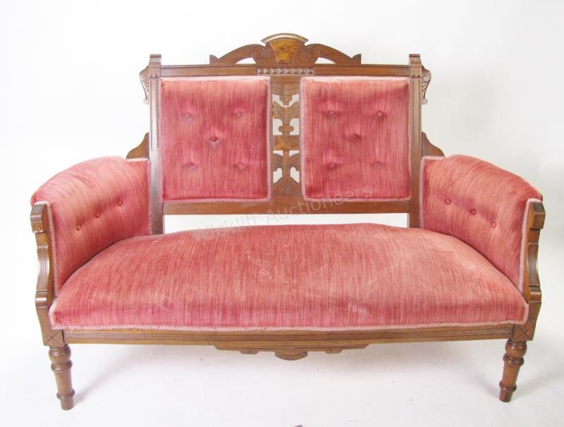 Appraisal: An antique walnut Victorian settee with burl walnut veneer decoration