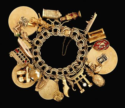 Appraisal: karat yellow gold international charm bracelet s Twenty-one enameled and