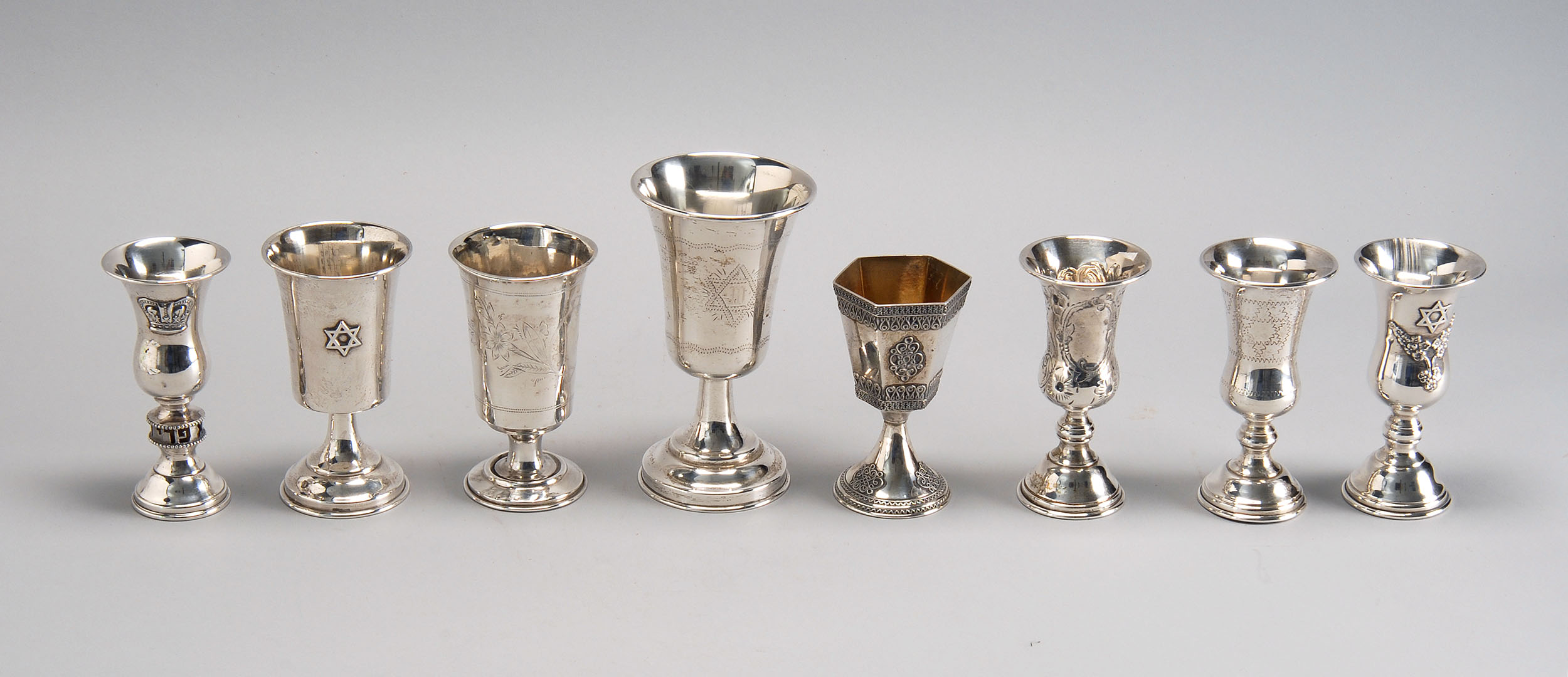 Appraisal: EIGHT STERLING AND SILVER PLATED KIDDISH CUPS By various makers