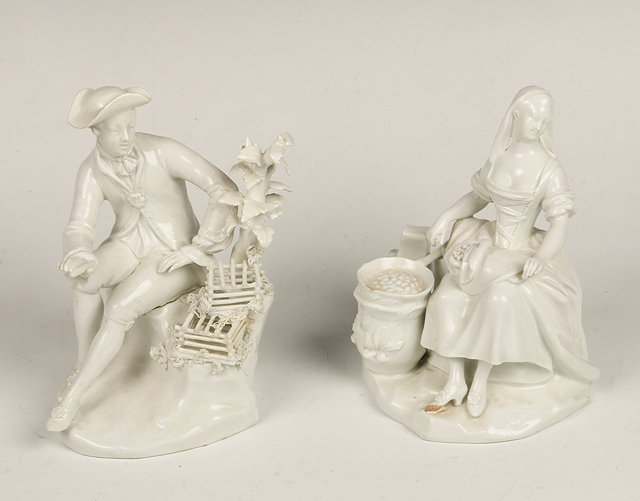 Appraisal: A PAIR OF VIENNA WHITE GLAZED PORCELAIN FIGURES of a