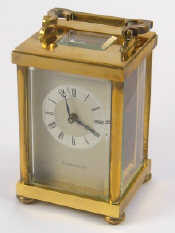 Appraisal: A gilt brass carriage clock with silvered chapter ring on