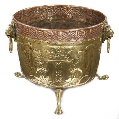 Appraisal: A Dutch copper and brass log bin embossed with a