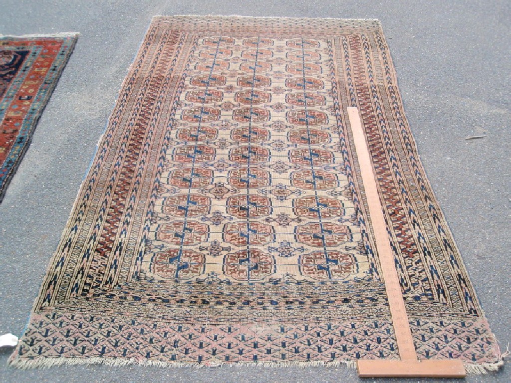 Appraisal: A Bokhara rug with multi-gul central field cm x cm