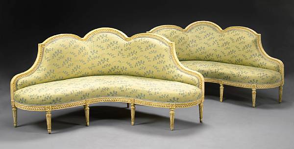 Appraisal: A pair of Louis XVI style paint decorated corner canape