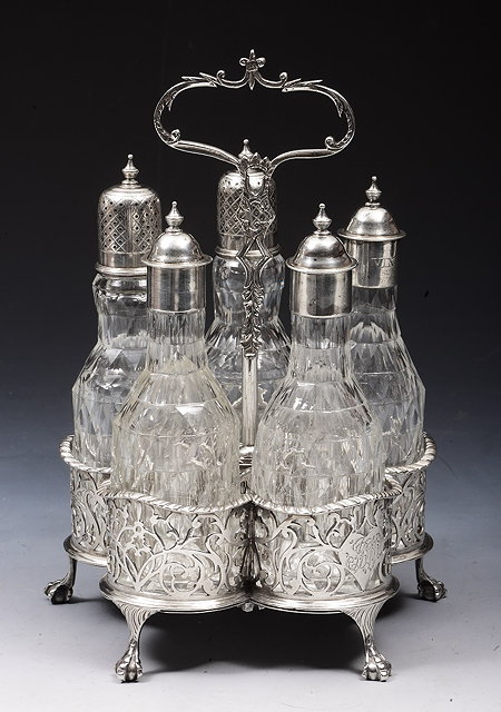 Appraisal: A GEORGE III SILVER CRUET STAND with five cut glass