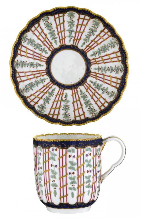 Appraisal: A FIRST PERIOD WORCESTER FLUTED COFFEE CUP AND SAUCER painted