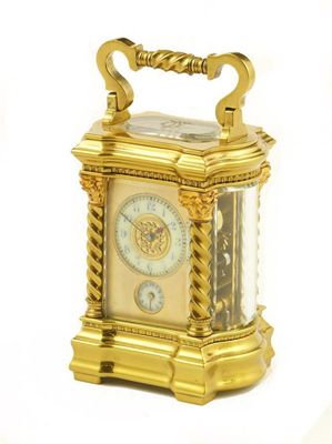 Appraisal: A French miniature gilt brass carriage clock with alarm the