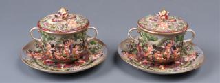 Appraisal: Pair of exuberantly decorated Capo-di-monte pots de creme with cherub