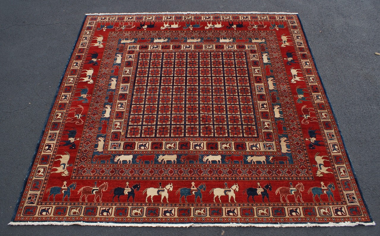 Appraisal: Persian Pictorial Carpet borders with stylized animals with block center