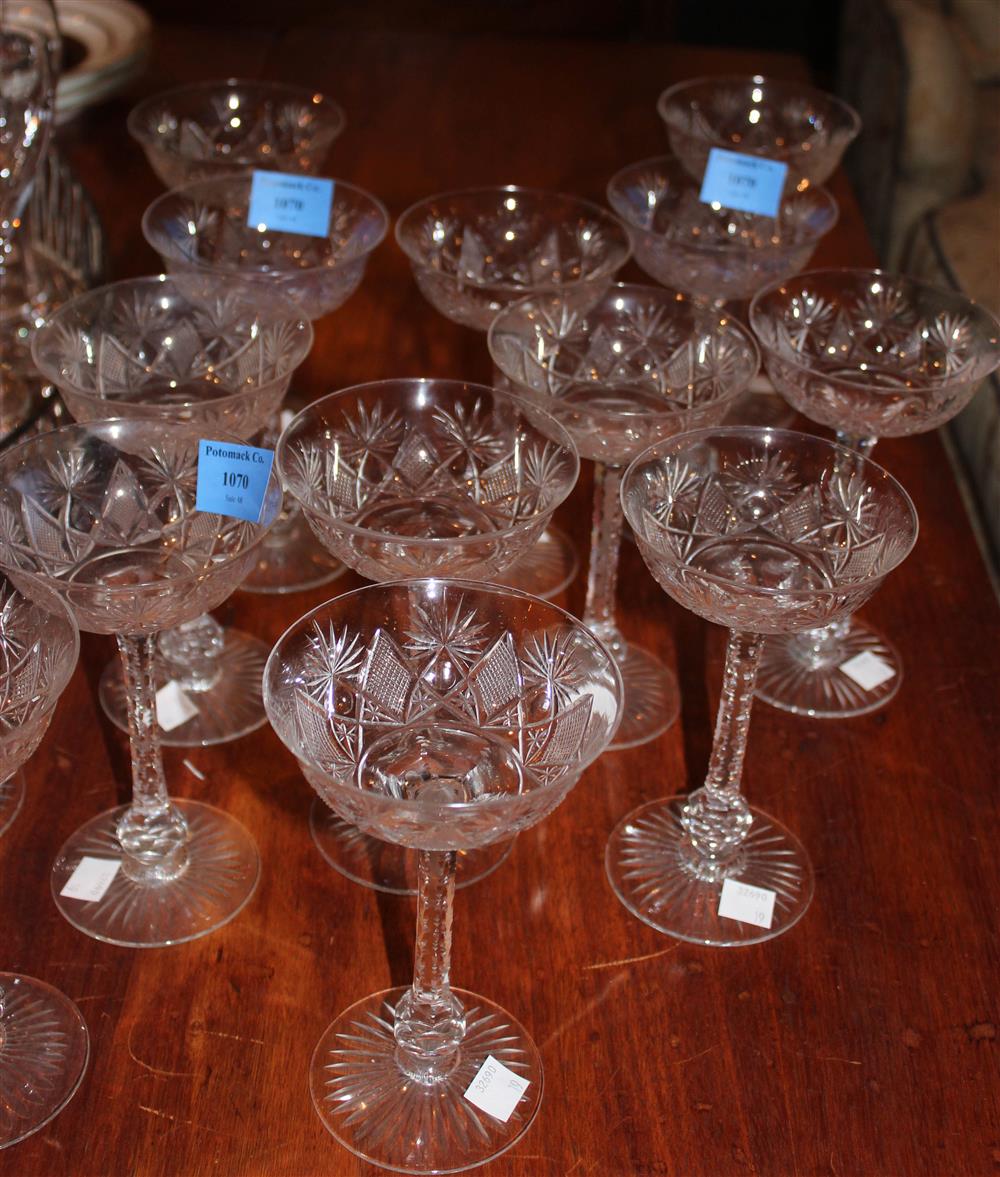 Appraisal: CRYSTAL STEMWARE CHAMPAGNE GLASSES with bright-cut stems - h in