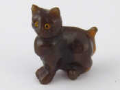 Appraisal: A dark green hardstone model of a kitten with inset