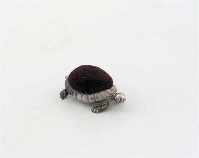 Appraisal: A turtle pin cushion by Saunders and Shepherd London in