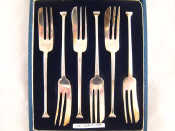 Appraisal: A cased set of six silver pastry forks Sheffield