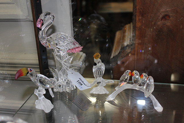 Appraisal: A GROUP OF FOUR SWAROVSKI CRYSTAL FIGURINES one depicting a