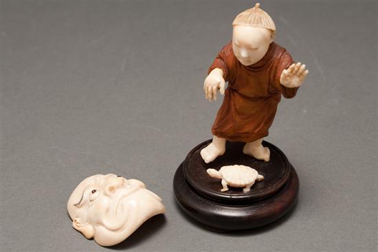 Appraisal: Japanese carved ivory and wood figure of a boy with